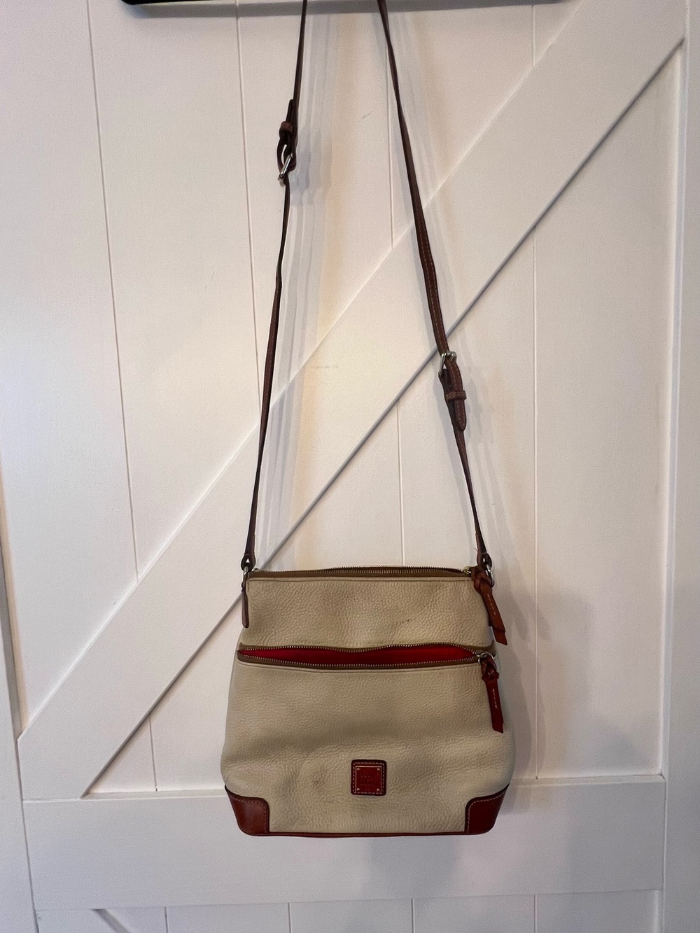 Dooney & Bourke Tan Crossbody with Brown Trim and Red Accent